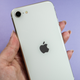A photo of a person holding the iPhone SE